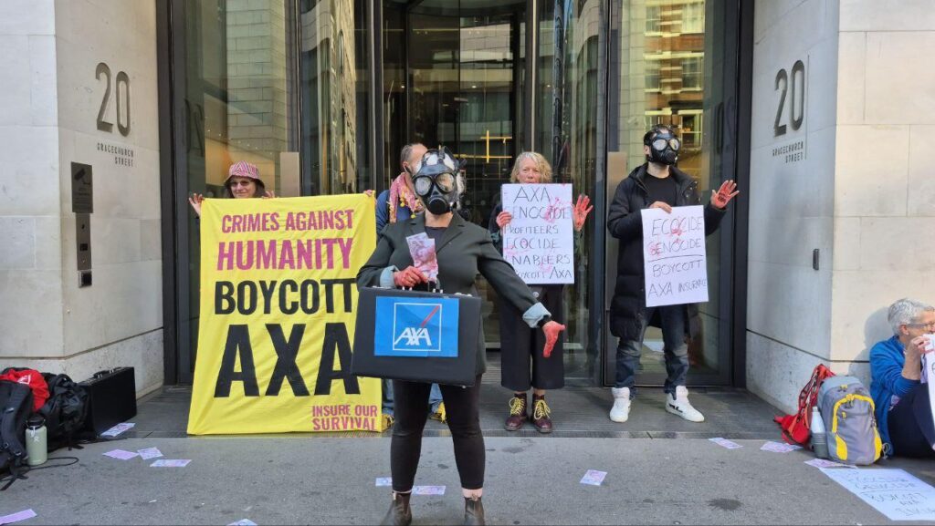 Demonstrator outside an insurance building wearing a gas mask