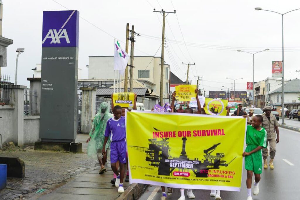 Group with IoS banner outside AXA